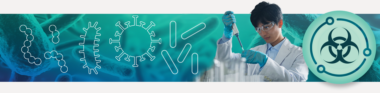 Lab worker wearing lab coat, safety goggles and using a pipette on a blue green background.